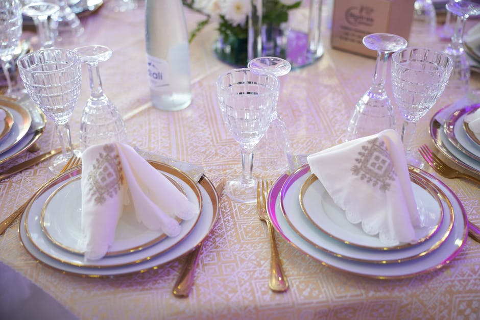 April Cornell pomegranate print tablecloth in jewel-tone colors on a set dining table